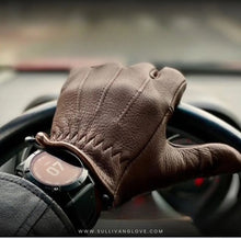 Load image into Gallery viewer, A man wearing chocolate deerskin driving gloves with vintage stitching showing a nice watch