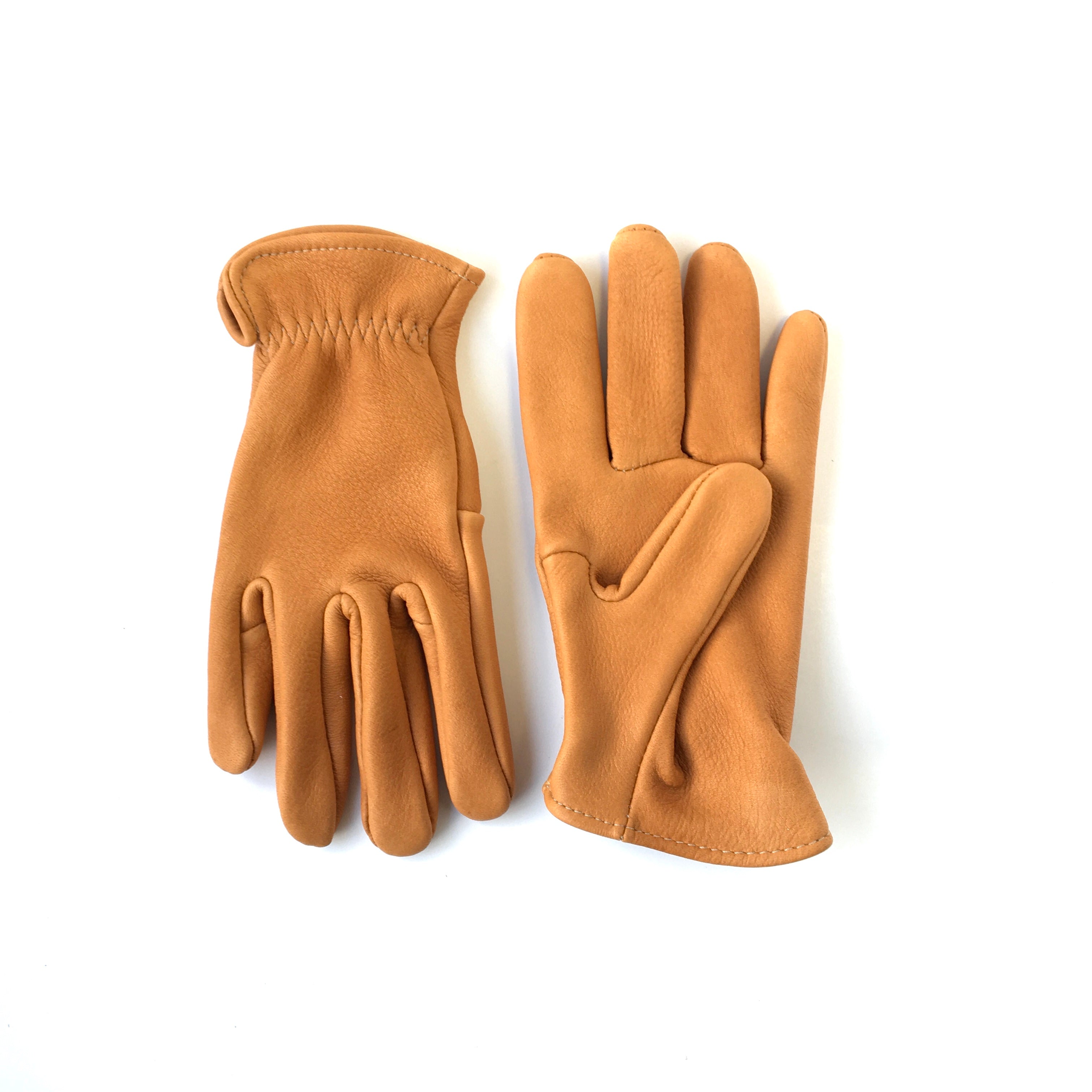 A pair of deerskin leather gloves - made in the USA - short cuff - saddle tan leather