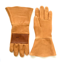 Load image into Gallery viewer, A pair of saddle tan deerskin leather gauntlets with knuckle patch