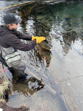 Load image into Gallery viewer, A man flyfishing in a snowy river wearing a pair of gold Elkskin gloves made in Bend Oregon, USA