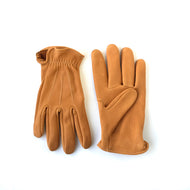 A pair of deerskin gloves short cuff with vintage stitch lines on the back saddle tan